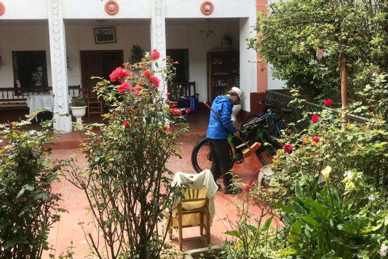 Alan cleaning bikes at our lovely Hospedaje Los Begonias