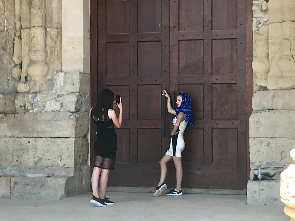 Georgian physique is typically on the larger side than these 2 lasses posing at the cathedrals back door