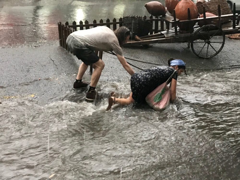 After we arrived at the restaurant for dinner the heavens opened, the pavement became a river and this poor woman fell in to the drink