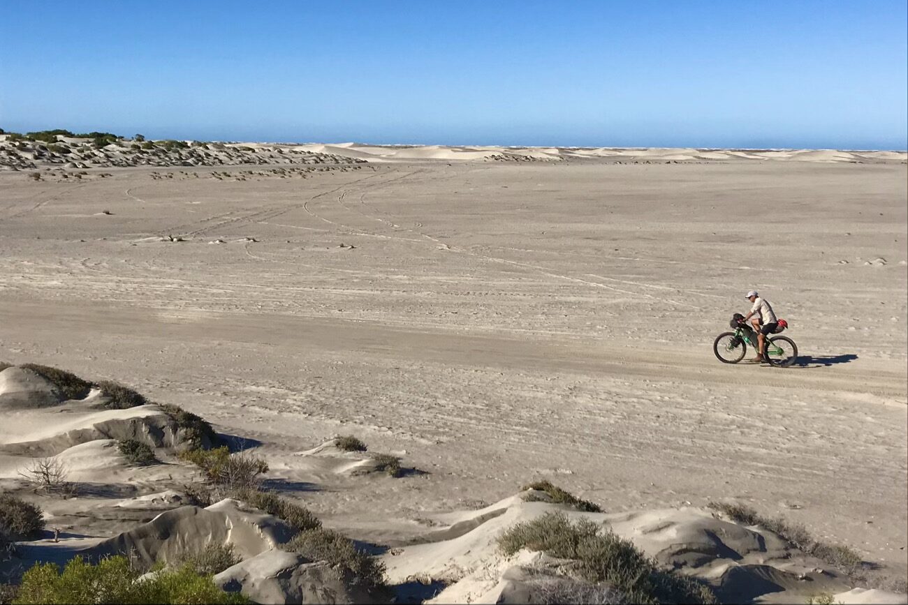 Cruising the dried out lake beds between the dunes and the coastal shrubs