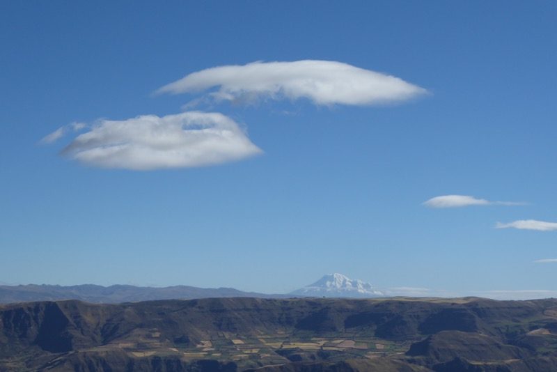 Cap clouds are the only indication of strong winds