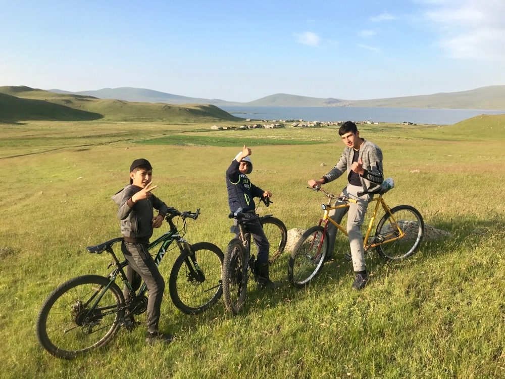 Artur, Arman and Rud visit us on their bikes from the village below. They each enjoy a ride on my bike.