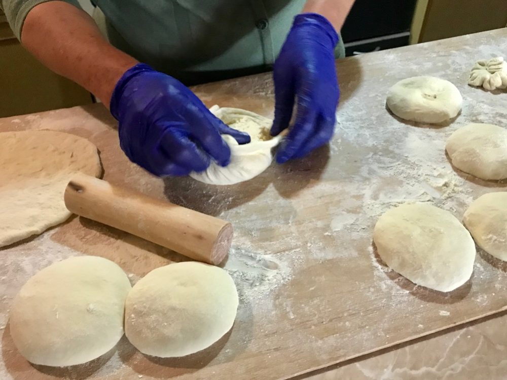 Making khachapuri, the cheese filled bread