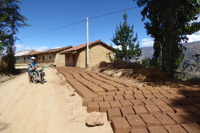 The houses are either mud brick or rammed earth, with the orange tiled roofs