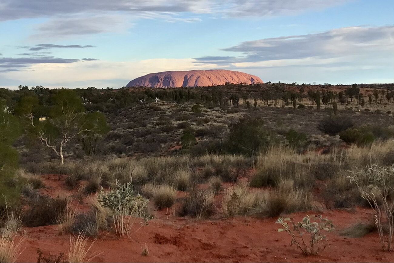 Uluṟu from a small hill in the tourist town of Yulara, 15km away