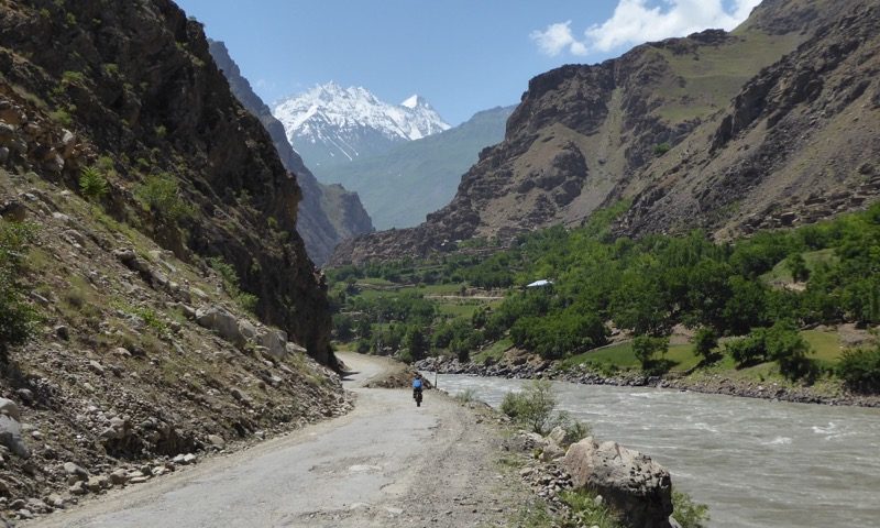 Heading up river, Afghan peaks towering above