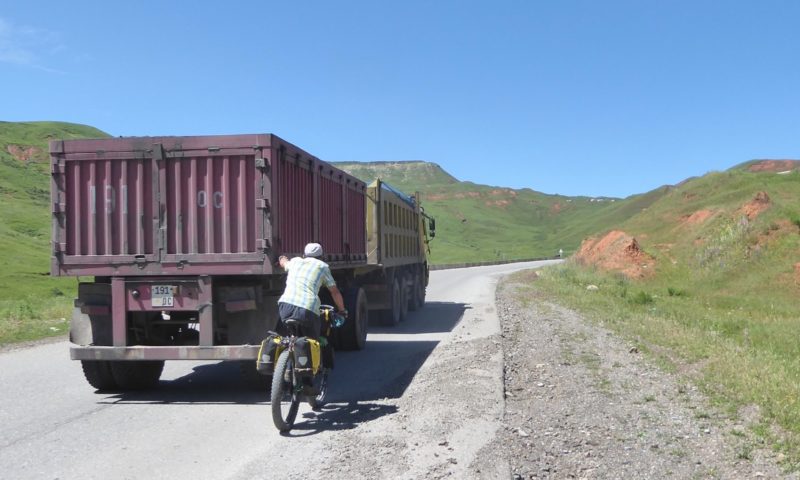 Hitching a ride with a coal truck near the top of the climb. The drivers  encouraged it but I was too chicken