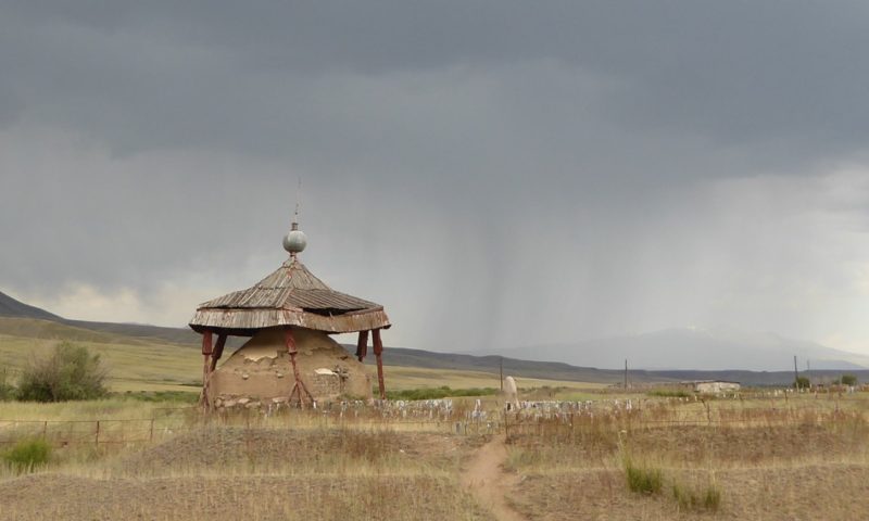 Incoming thunderstorm over old protected tomb