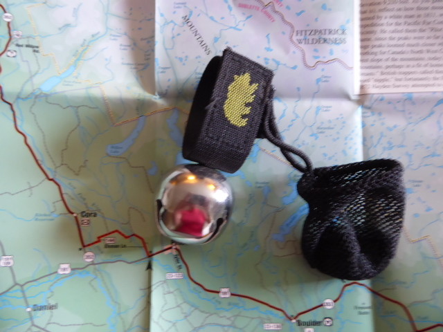 A bear bell, hangs off the bike, saves singing as you ride.the cover has a magnet which shuts it up!
