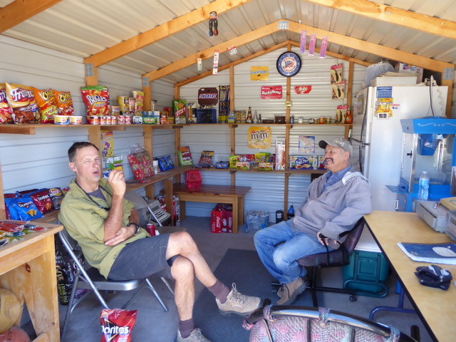 Chewing the fat at roadside snack shack in Canon Plaza primarily there for Great Divide riders as the wife of the chap here competed in the Tour Divide over 10 years ago