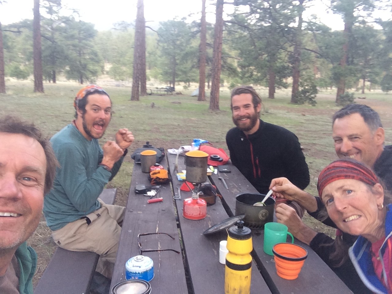 Rob, Brian and Alex, and us enjoying dinner at our last camp before Pie Town